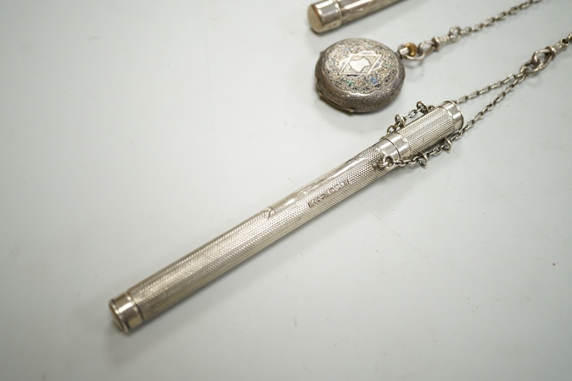An Edwardian pierced silver chatelaine, by Samuel Jacob, London, 1902, with three accoutrements to include two silver cases and a enamelled fob watch, overall length 34cm.
